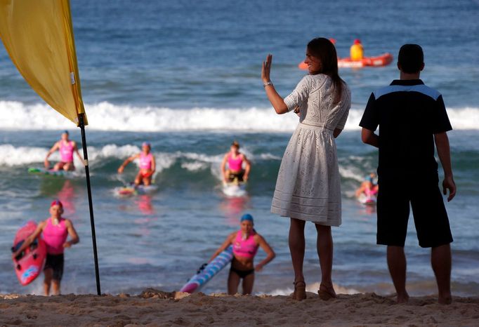 Catherine, Britain's Duchess of Cambridge, waves as she watches junior surf lifesavers during a visit to Sydney's Manly beach