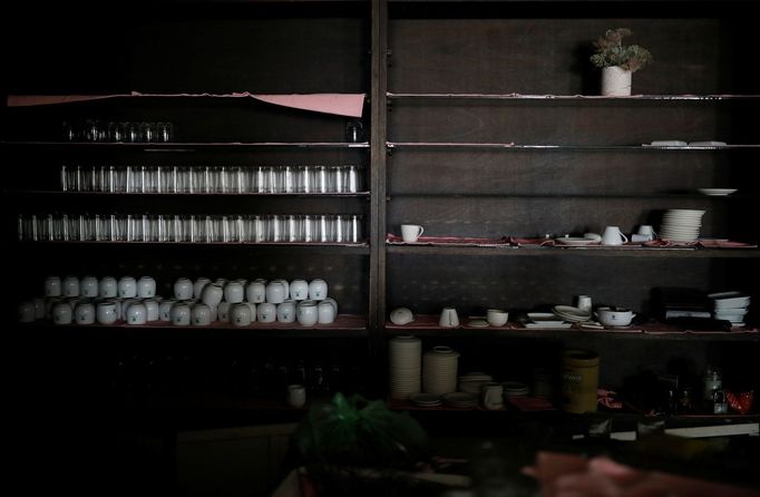 Tableware lies on shelves at a restaurant