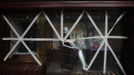 Display panels of a store at Tsim Sha Tsui shopping district are seen taped together as part of safety measures in preparation for Typhoon Vicente, in Hong Kong July 24, 2012. A severe typhoon hit Hong Kong on Tuesday, disrupting business across the financial hub, with offices and the stock market to remain closed for at least part of the morning after the city raised its highest typhoon warning overnight. REUTERS/Tyrone Siu (CHINA - Tags: ENVIRONMENT DISASTER BUSINESS) Published: Čec. 24, 2012, 3:11 dop.