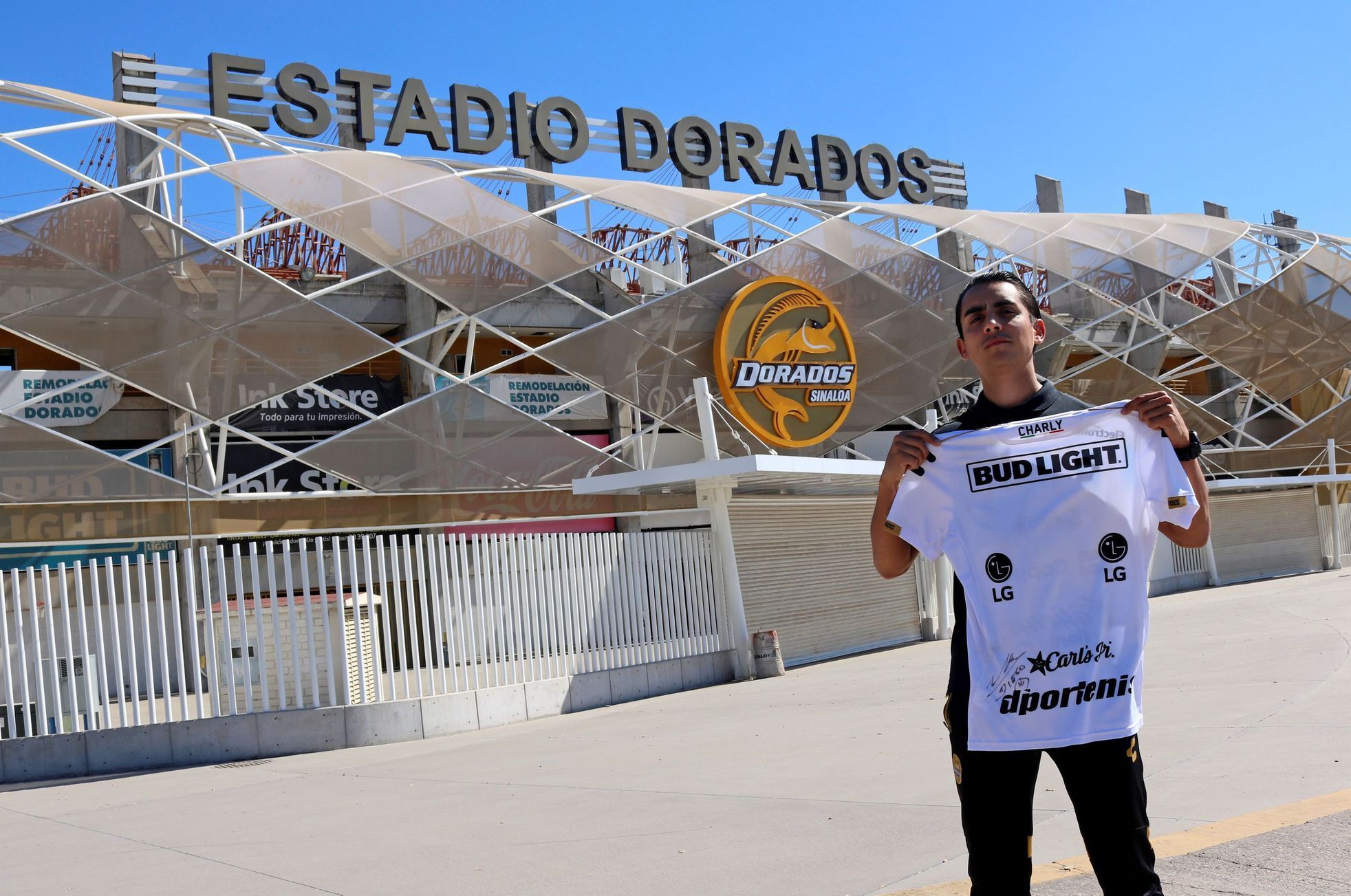 A fan shows a jersey of the Dorados de Culiacan team signed by late Argentine soccer Maradona outside the Dorados stadium in Culiacan