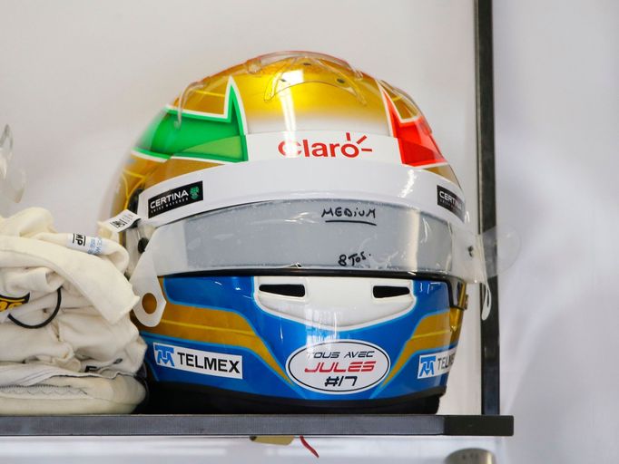 A helmet of Sauber Formula One driver Esteban Gutierrez of Mexico with a sticker in support of Marussia Formula One driver Jules Bianchi is pictured before the third prac