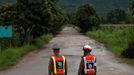 Police officers block a road leading to Tham Luang cave complex in the northern province of Chiang Rai