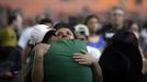 Relatives of victims of the fire at Boate Kiss nightclub attend a collective wake in the southern city of Santa Maria, 187 miles (301 km) west of the state capital Porto Alegre, January 27, 2013. The nightclub fire killed at least 232 people in Santa Maria early on Sunday when a band's pyrotechnics show set the building ablaze and fleeing partygoers stampeded toward blocked and overcrowded exits in the ensuing panic, officials said. REUTERS/Ricardo Moraes (BRAZIL - Tags: DISASTER OBITUARY TPX IMAGES OF THE DAY) Published: Led. 27, 2013, 10:29 odp.