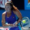 Jelena Jankovic of Serbia hits a return to Misaki Doi of Japan during their women's singles match at the Australian Open 2014 tennis tournament in Melbourne