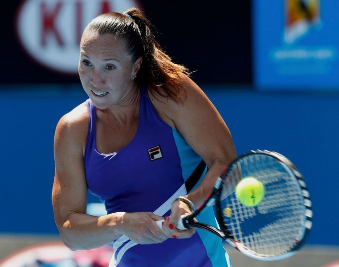 Jelena Jankovic of Serbia hits a return to Misaki Doi of Japan during their women's singles match at the Australian Open 2014 tennis tournament in Melbourne January 14, 2