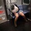 Halloween reveler sleeps on the uptown 6 subway train early in the morning in the Manhattan borough of New York