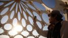 Bingram Lai explores "Zonotopia and the Two Trees" during the Burning Man 2012 "Fertility 2.0" arts and music festival in the Black Rock Desert of Nevada, August 29, 2012. More than 60,000 people from all over the world have gathered at the sold out festival, which is celebrating its 26th year, to spend a week in the remote desert cut off from much of the outside world to experience art, music and the unique community that develops.