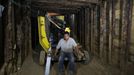 Palestinian workers drag parts of a car body by a four-wheels vehicle inside a huge tunnel for smuggling cars and spare parts beneath the border between Egypt and southern Gaza Strip in Rafah. by Wissam Nassar.