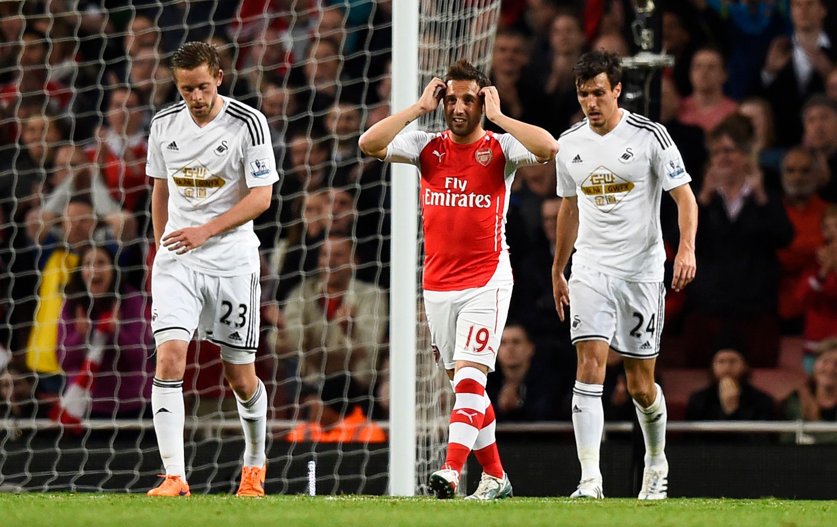 Football: Arsenal's Santi Cazorla looks dejected after missing a chance to score