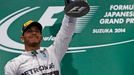 Mercedes Formula One driver Lewis Hamilton of Britain celebrates after winning the Japanese F1 Grand Prix at the Suzuka Circuit October 5, 2014. REUTERS/Toru Hanai (JAPAN