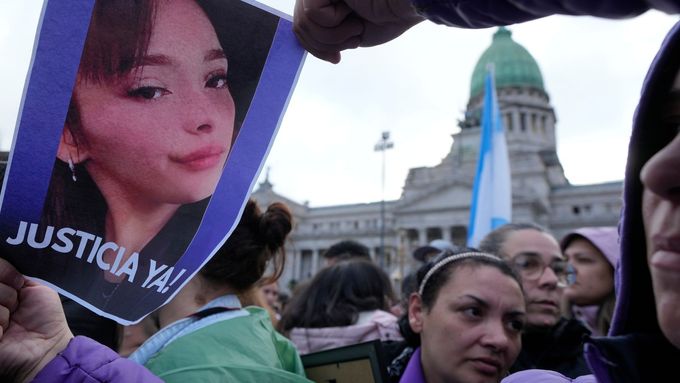 A woman holds an image of Lara Gutierrez as relatives and friends of Brenda del Castillo, Morena Verdi and Gutierrez, gather to protest their torture and killing, which a