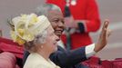 This is a Tuesday July 9 1996 file photo of South African President Nelson Mandela as he waves to crowds as he sits next to Queen Elizabeth II in a an open carriage on th