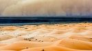 Desert Sandstorm - (PICTURED Asand storm over the Sahara) - Peter Vruggink captures an incredible sandstorm over the Sahara desert while camel trekkers walk in the distance.