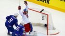 Jan Kolar of the Czech Republic (C) celebrates his goal against France's goalie Florian Hardy (unseen) during the overtime period of their men's ice hockey World Champion