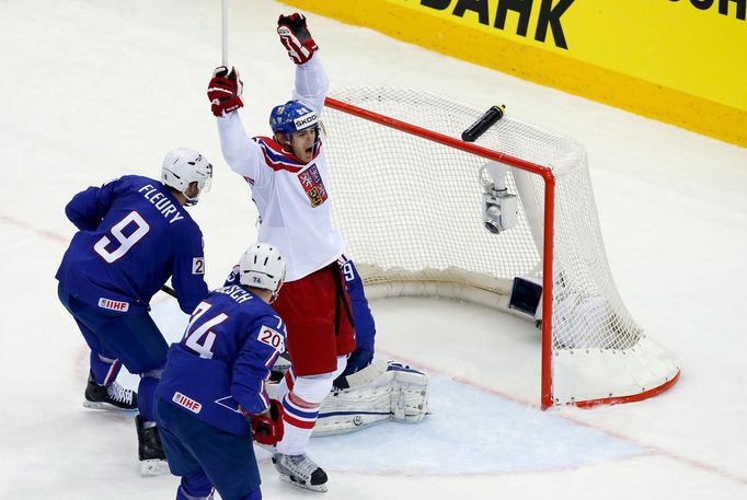 Jan Kolar of the Czech Republic (C) celebrates his goal against France's goalie Florian Hardy (unseen) during the overtime period of their men's ice hockey World Champion