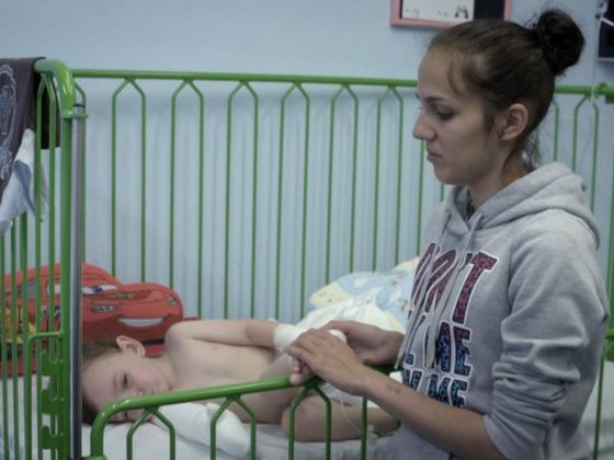 Kristýna with her son in the burn centre.