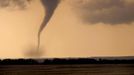 Tornado Moving Across Farmland in Oklahoma An F3 class tornado moves across farmland in Arnett, Oklahoma. Strong tornadoes like this one usually develop from a specific type of thunderstorm called supercells, which contain mesocyclones. Mesocyclones are a large area of rotating updraft in the atmosphere, between 1 and 6 miles across, that can cause tornadoes to form. | Location: Arnett, Oklahoma, USA.