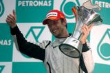 Brit Jenson Button ze stáje Brawn GP se raduje z vítězství i v Malajsii.