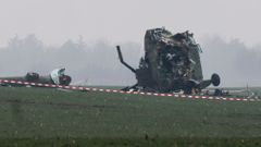 The wreckage of a military helicopter is pictured at the crash site near Belgrade airport