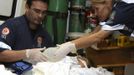 A woman, who was wounded during a fire at Boate Kiss nightclub, is transferred from a hospital in Santa Maria to receive treatment at Porto Alegre hospital in the southern city of Santa Maria, 187 miles (301 km) west of the state capital Porto Alegre early January 28, 2013. The nightclub fire killed at least 232 people in Santa Maria early on Sunday when a band's pyrotechnics show set the building ablaze and fleeing partygoers stampeded toward blocked and overcrowded exits in the ensuing panic, officials said. REUTERS/Ricardo Moraes (BRAZIL - Tags: DISASTER HEALTH) Published: Led. 28, 2013, 5:02 dop.