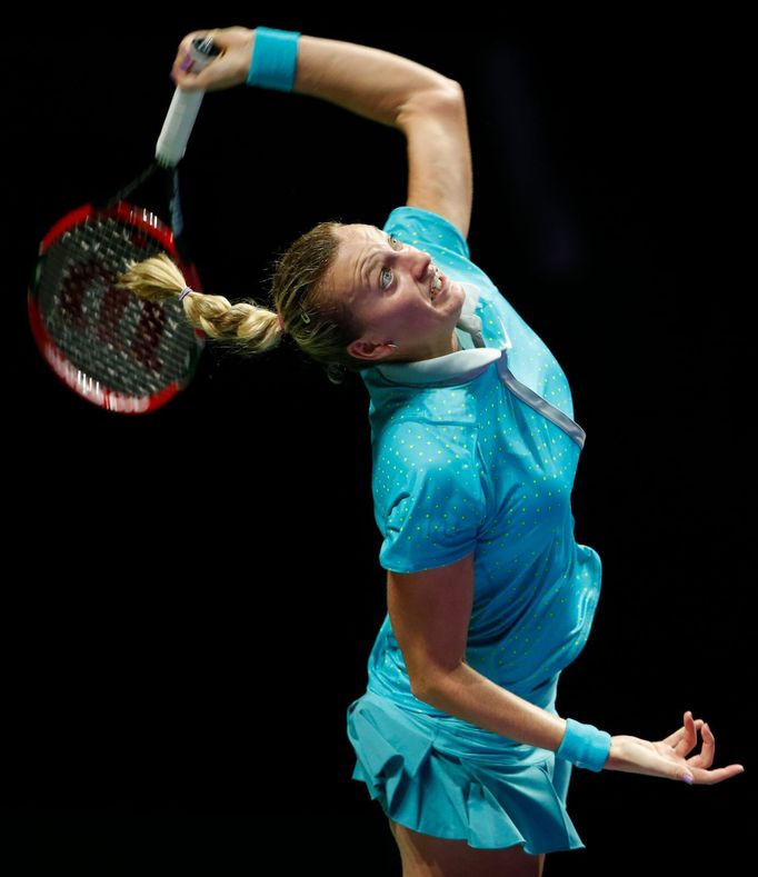 Petra Kvitova of the Czech Republic serves against Agnieszka Radwanska of Poland during their WTA Finals singles tennis match at the Singapore Indoor Stadium October 22,