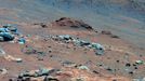 Carbonate-Containing Martian Rocks (False Color) Lengthy detective work with data NASA's Mars Exploration Rover Spirit collected in late 2005 has confirmed that an outcrop called "Comanche" contains a mineral indicating that a past environment was wet and non-acidic, possibly favorable to life. Spirit used its panoramic camera to capture this view of the Comanche outcrop during the 689th Martian day, or sol, of the rover's mission on Mars (Dec. 11, 2005). The rover's Moessbauer spectrometer, miniature thermal emission spectrometer and alpha particle X-ray spectrometer each examined targets on Comanche that month. On June 3, 2010, scientists using data from all three spectrometers reported that about one-fourth of the composition of Comanche is magnesium iron carbonate. That concentration is 10 times higher than for any previously identified carbonate in a Martian rock. Carbonates originate in wet, near-neutral conditions but dissolve in acid. The find at Comanche is the first unambiguous evidence from either Spirit of its twin, Opportunity, for a past Martian environment that may have been more favorable to life than the wet but acidic conditions indicated by the rovers' earlier finds. In this image, Comanche is the dark reddish mound above the center of the view. The image is presented in false color, which makes some differences between materials easier to see. It combines three separate exposures taken through filters admitting wavelengths of 750 nanometers, 530 nanometers and 430 nanometers. The main Comanche outcrop is about 5 meters (16 feet) from left to right from this perspective. The paler material visible at bottom right is part of another outcrop, "Algonquin." Image Credit: NASA/JPL-Caltech/Cornell University