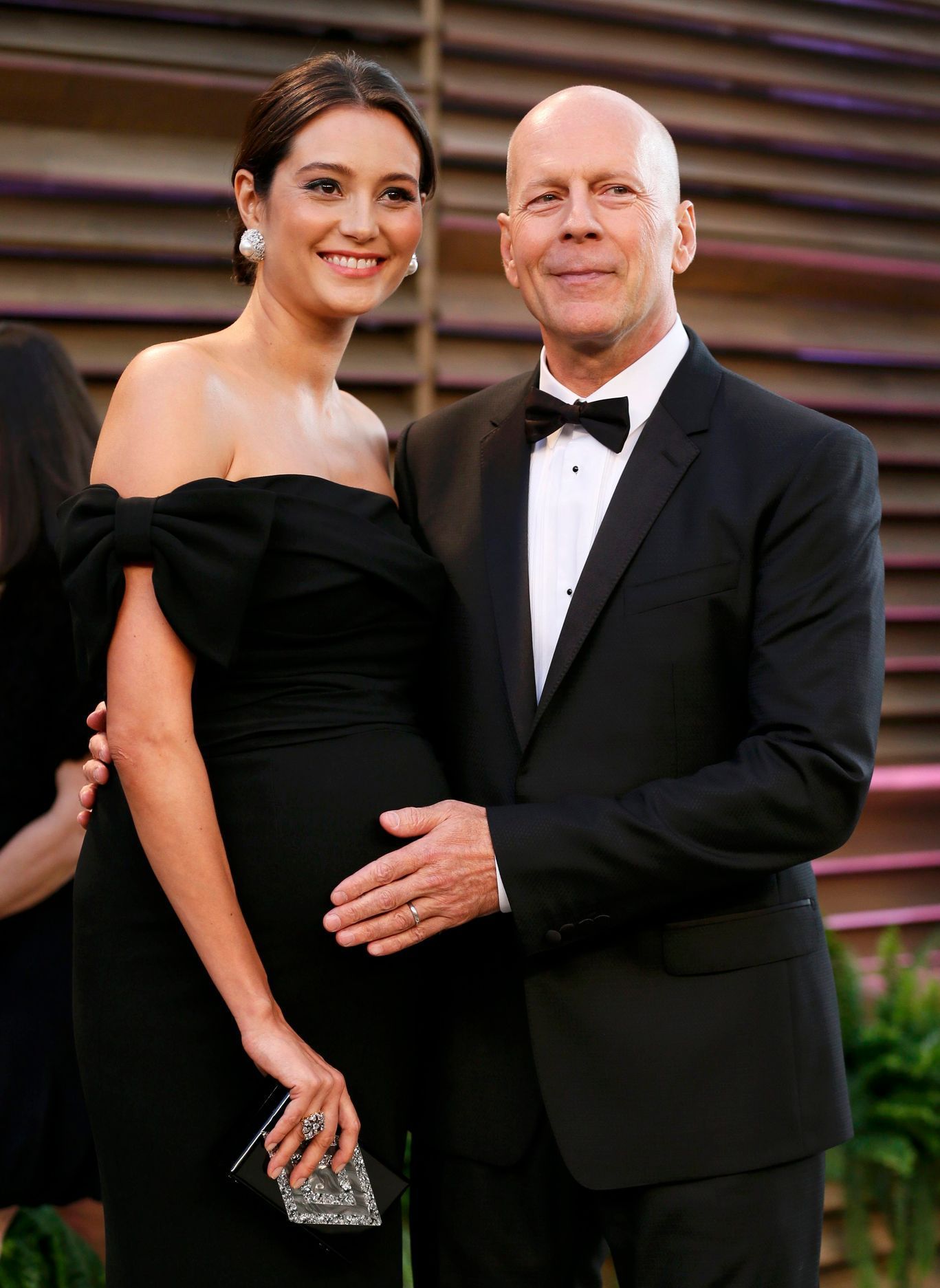 Actor Bruce Willis and his wife Emma Heming arrive at the 2014 Vanity Fair Oscars Party in West Hollywood