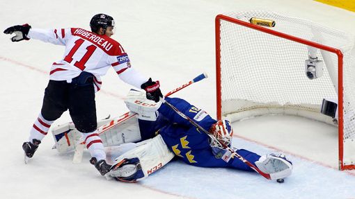 Sweden's goalie Anders Nilsson saves a penalty shot of Canada's Jonathan Huberdeau (L) during the first period of their men's ice hockey World Championship Group A game a