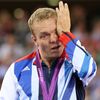 FILE PHOTO: Britain's gold medallist Chris Hoy cries on the podium during the victory ceremony for the track cycling men's keirin event at the Velodrome during the London 2012 Olympic Games