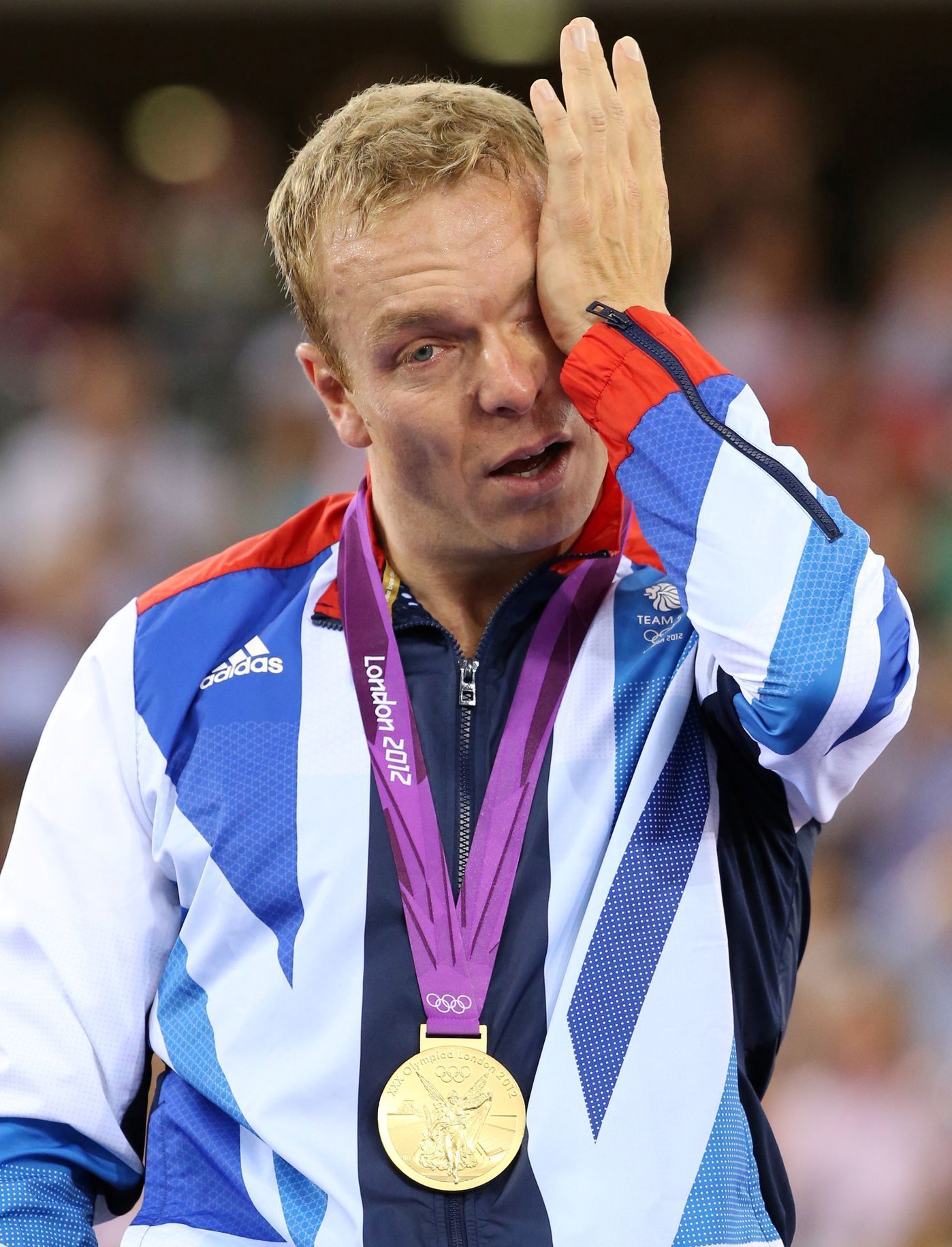 FILE PHOTO: Britain's gold medallist Chris Hoy cries on the podium during the victory ceremony for the track cycling men's keirin event at the Velodrome during the London 2012 Olympic Games