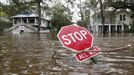 A stop sign is seen on a flooded street after Hurricane Isaac hit Mandeville, Louisiana, August 30, 2012. REUTERS/Jonathan Bachman (UNITED STATES - Tags: ENVIRONMENT DISASTER) Published: Srp. 30, 2012, 7:39 odp.