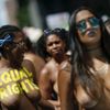 People take part in a topless march in New York