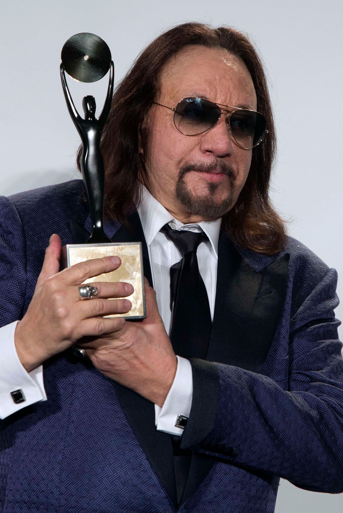 Kiss band member Frehley poses with his award after rock band was inducted at 29th annual Rock and Roll Hall of Fame Induction Ceremony in Brooklyn, New York