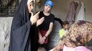 Picture released by the United Nations High Commissioner for Refugees (UNHCR) shows UNHCR goodwill ambassador, Angelina Jolie listening to a displaced Iraqi woman at a makeshift camp, at an undisclosed location northwest of Baghdad, on July 23, 2009. Jolie is on a one-day trip to Iraq to see first-hand the plight of hundreds of thousands of families uprooted by the ongoing conflict. The UNHCR refused to name the camp for security reasons.