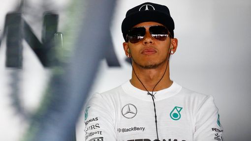 Mercedes Formula One driver Lewis Hamilton waits during the first free practice session ahead of the German F1 Grand Prix at the Hockenheim racing circuit, July 18, 2014.