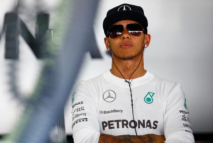 Mercedes Formula One driver Lewis Hamilton waits during the first free practice session ahead of the German F1 Grand Prix at the Hockenheim racing circuit, July 18, 2014.