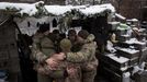 Military Chaplains Yevhen and Oleksandr pray with soldiers of the 93rd separate mechanized brigade during a Christmas Day service near the front line in the Donetsk regio