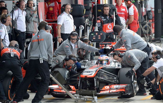 McLaren Formula One driver Jenson Button of Britain makes a pit stop during qualifying the British Grand Prix at the Silverstone Race circuit, central England, June 29, 2