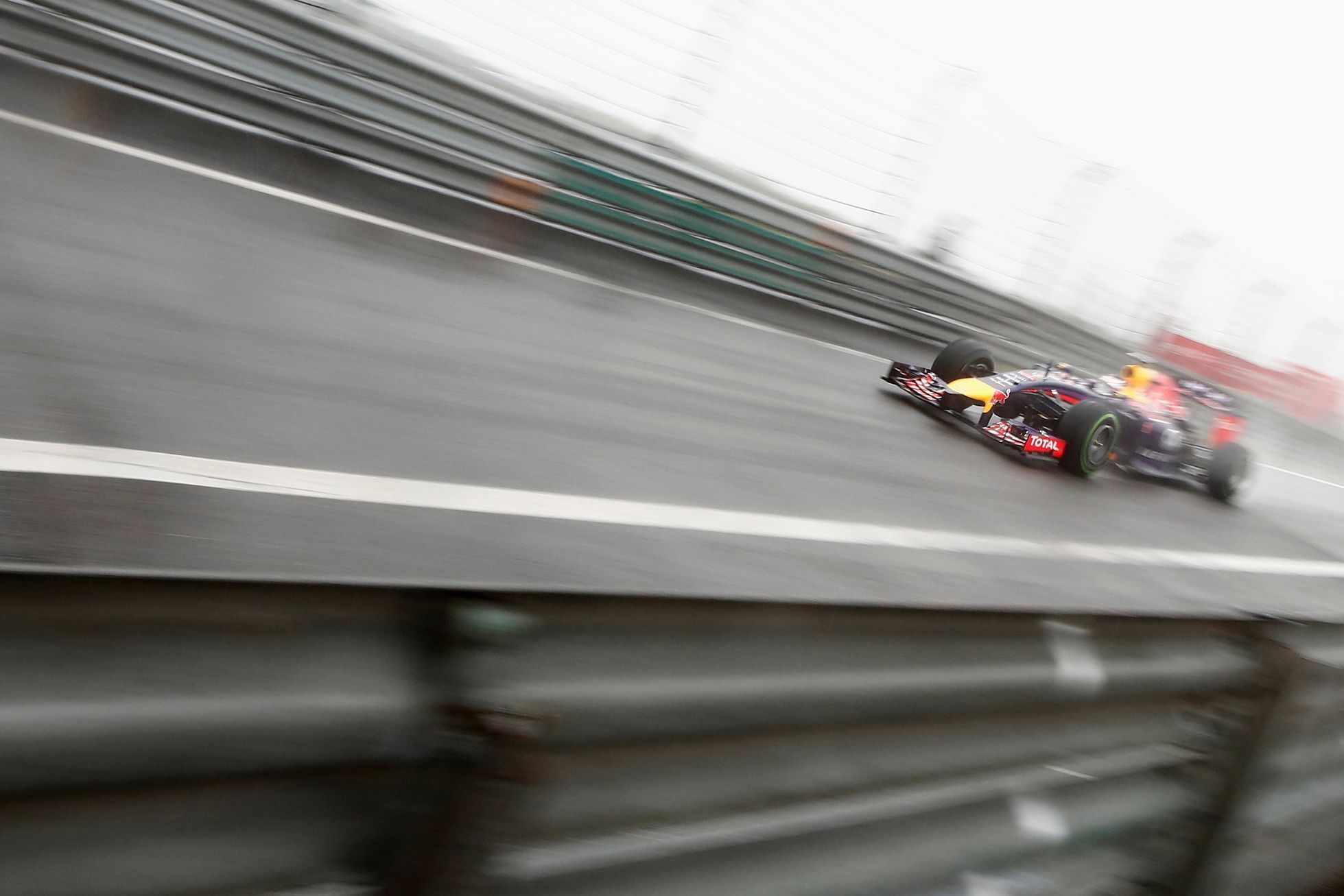 Red Bull Racing Formula One driver Vettel of Germany drives during the qualifying session for the Chinese F1 Grand Prix at the Shanghai International circuit