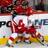 Calgary Flames' Cammalleri and Detroit Red Wings' Kindl batt