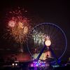 Fireworks explode near the observation wheel during a pyrotechnic show to celebrate the New Year in Hong Kong