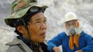 To go with story Indonesia-volcano-mine by Jerome Rivet A picture taken on March 8, 2010 shows Indonesian sulphur miners taking a break from their labours at the Kawah Ij