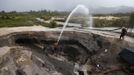 Miners dig with pressure hoses near the town of Ikabaru, south of Venezuela, November 13, 2012. In the triangle that connects Venezuela, Brazil and Guyana a huge number of illegal gold and diamonds prospectors or garimpeiros dream of changing their lives overnight by finding a huge bonanza. Picture taken November 13, 2012. REUTERS/Jorge Silva (VENEZUELA - Tags: BUSINESS EMPLOYMENT SOCIETY) ATTENTION EDITORS: PICTURE 4 OF 20 FOR PACKAGE 'DIAMONDS IN THE JUNGLE'. TO FIND ALL IMAGES SEARCH 'DIAMONDS PROSPECTORS' Published: Pro. 3, 2012, 10:01 dop.