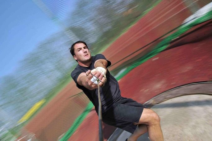 Kozmus of Slovenia throws a hammer during his training for the 2012 London Olympics in Brezice