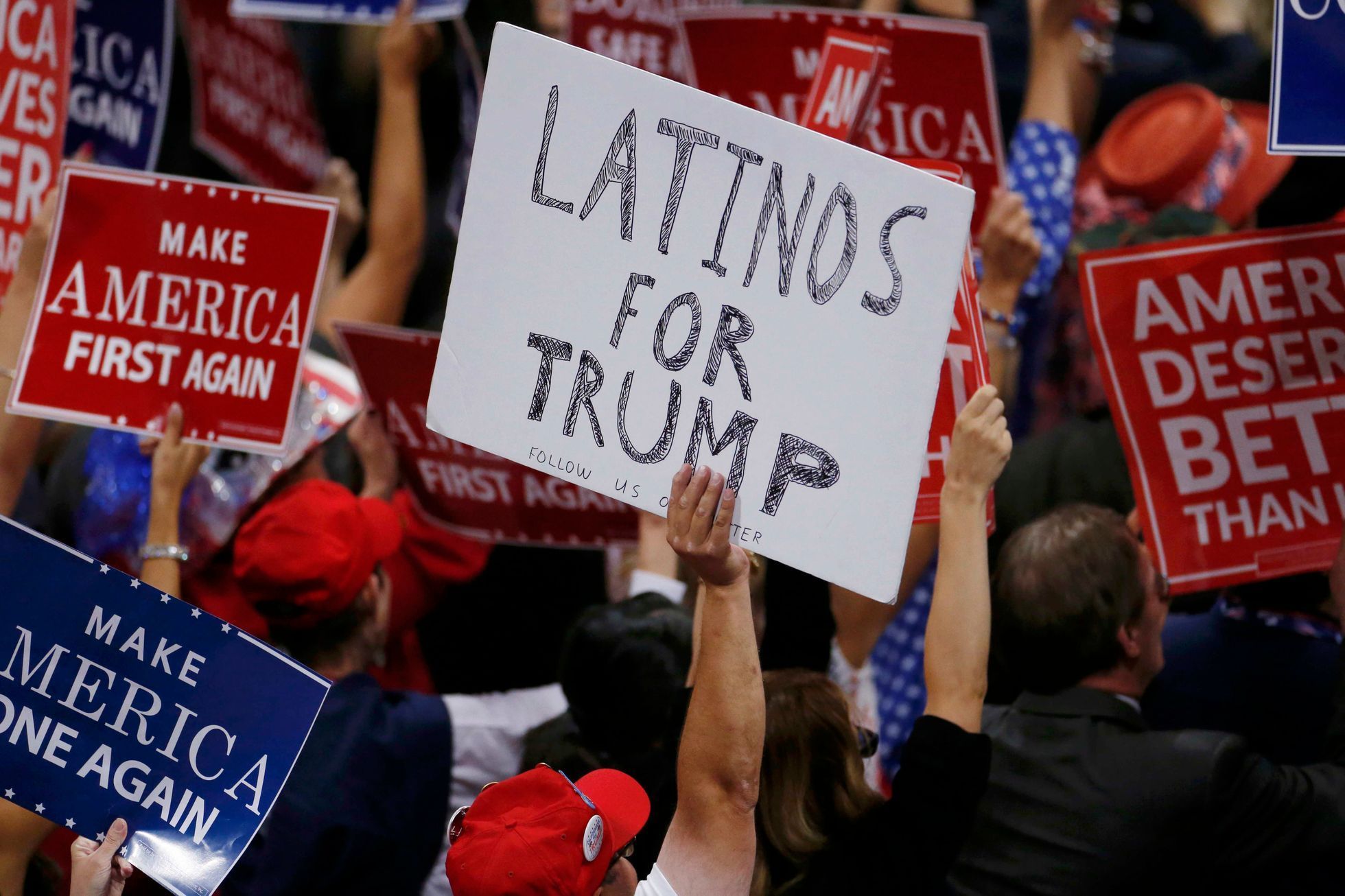 A person holds a sign reading Latinos for Trump on the third day of the Republican National Convention in Cleveland, Ohio