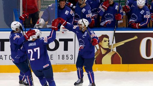France's Laurent Meunier (C) celebrates his goal against the Czech Republic with team mates during the first period of their men's ice hockey World Championship Group A g