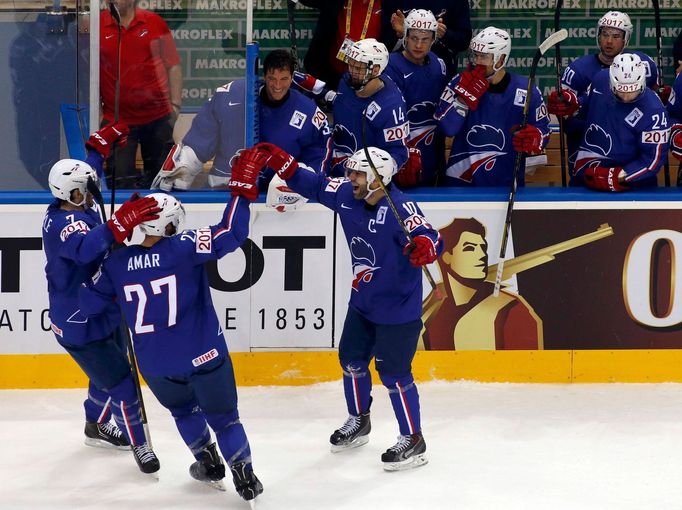 France's Laurent Meunier (C) celebrates his goal against the Czech Republic with team mates during the first period of their men's ice hockey World Championship Group A g