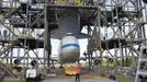 Space center workers watch as space shuttle Discovery is approached by a NASA 747 aircraft, which was towed into the Mate Demate facility at Kennedy Space Center in Cape Canaveral