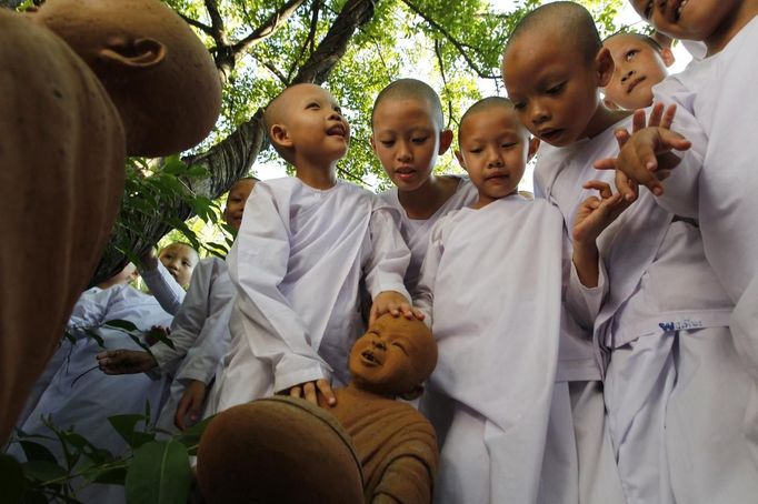 Novice Thai nuns play at the Sathira Dammasathan Buddhist meditation centre in Bangkok