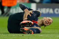 Paris St Germain's Zlatan Ibrahimovic lies injured